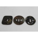 Japanese bronze tsuba with decoration depicting a Dragon, together with two other bronze tsuba's (3)