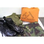 Four boxes of military clothing and uniform to include hats, helmets and jacket and Police hats.