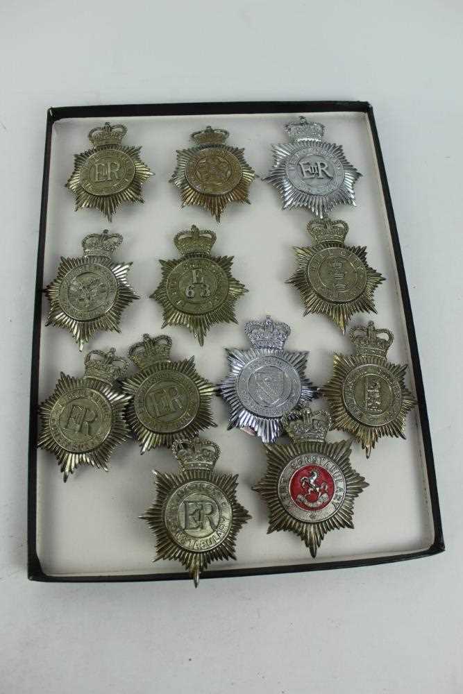 Three cases of Elizabeth II Police helmet plates and other badges to include Warwickshire, Dorset an - Image 3 of 3