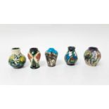 Five Moorcroft miniature vases in different patterns, all with impressed marks to base