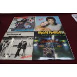 Two boxes of vinyl records including approximately 45 LP's and 100 plus singles including Iron Maide