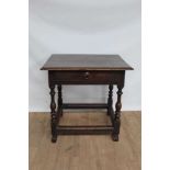 Early 18th century oak side table with single drawer, on turned legs joined by black stretchers and