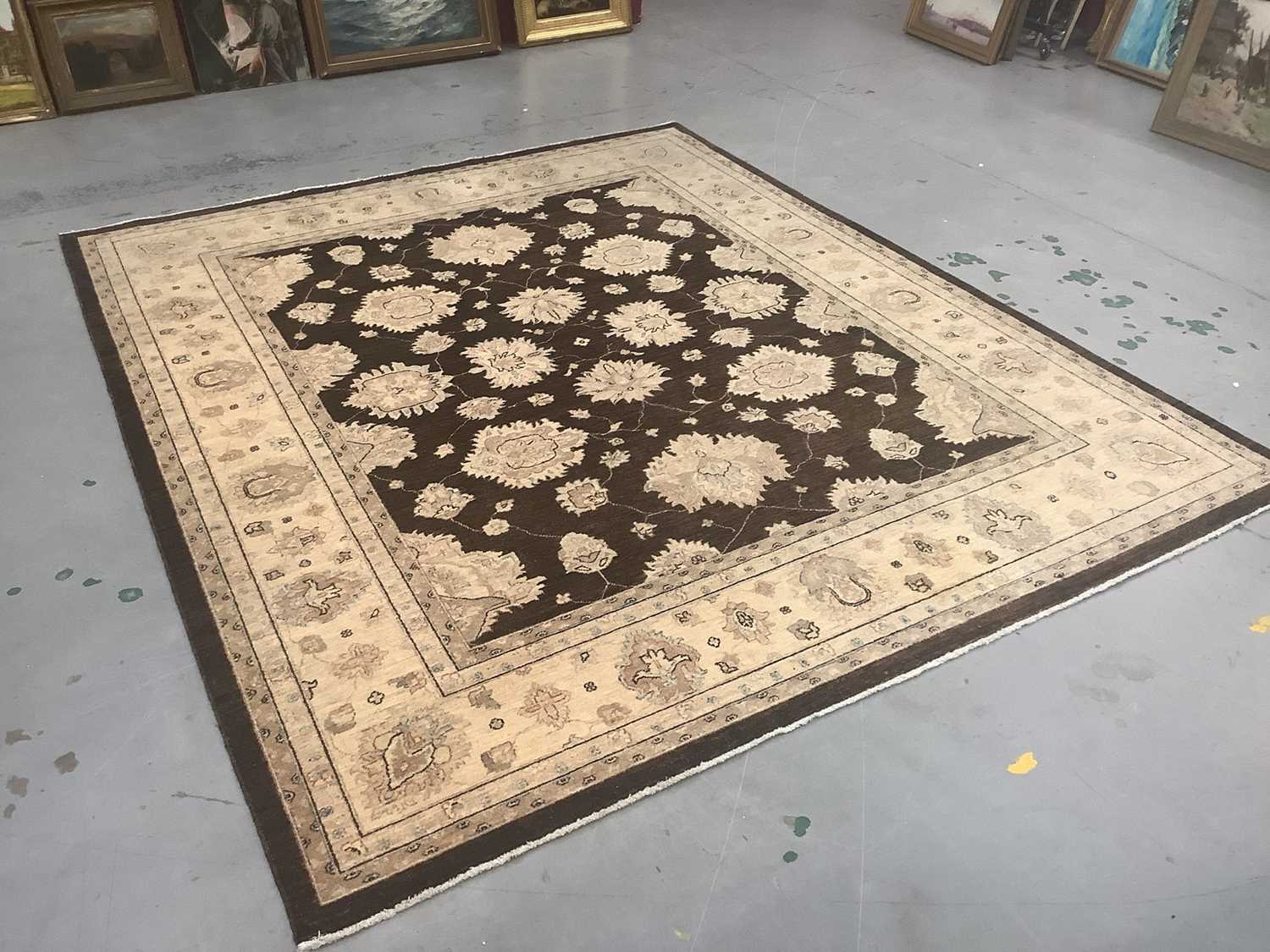 Afghan carpet wool pile carpet with floral design on brown and cream ground, 307cm x 278cm