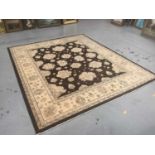 Afghan carpet wool pile carpet with floral design on brown and cream ground, 307cm x 278cm