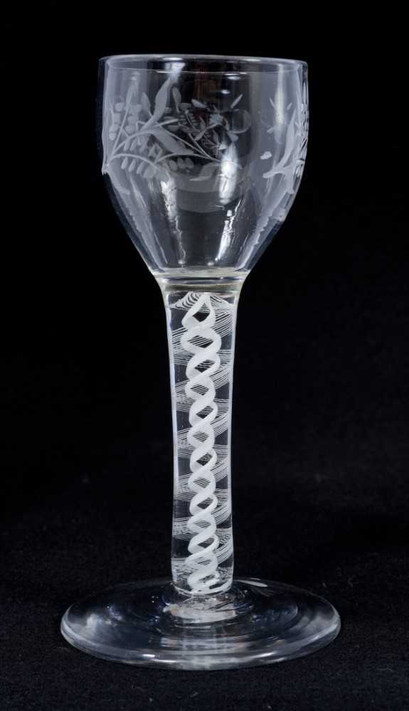 18th century wine glass with floral spray engraved bowl on double opaque twist stem on splayed foot