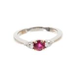 Tiffany & Co. ruby and diamond three stone platinum ring, the round mixed cut ruby estimated to weig