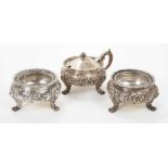 George V three piece cruet set comprising mustard and pair of salts, Birmingham 1910 / 1913