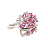 Ruby and diamond cocktail ring with eleven marquise cut rubies estimated to weigh approximately 2.29