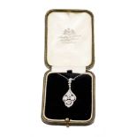 Edwardian diamond pendant with a quatrefoil cluster of four old cut diamonds in openwork millegrain
