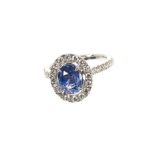 Sapphire and diamond cluster ring with a cushion cut unheated Burmese blue sapphire weighing 2.02cts