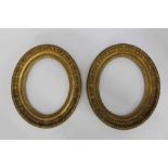 Pair of 19th century carved giltwood oval picture frames, 32cm x 25cm, 43cm x 37cm overall