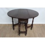 18th century oak oval gateleg table of small proportions, with single drawer, on turned supports joi