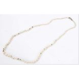 Natural saltwater and cultured pearl necklace with a string of graduated pearls, the smaller