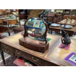 George III mahogany toilet mirror with oval mirrored plate and three drawers below, 58cm.