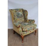 Georgian-style wing armchair, unusually upholstered in needlework depicting landscape panels and fru