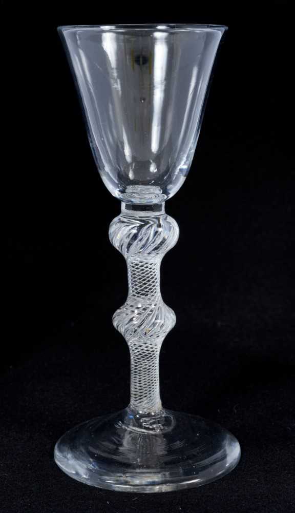 18th century wine glass with bell-shaped bowl, double knoped air twist stem on splayed foot 16 cm