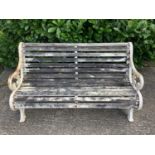 Victorian style cast iron garden bench with wooden slats