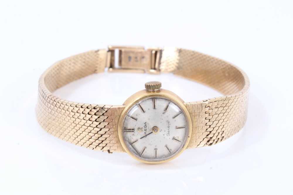 Ladies Omega 9ct gold wristwatch on integral gold milanese bracelet