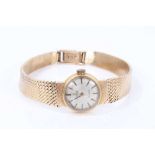 Ladies Omega 9ct gold wristwatch on integral gold milanese bracelet