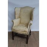 19th century wing arm chair of good proportions, upholstered in yellow silk fabric, on mahogany legs