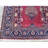 Fine pair of pink ground Pakistani Kashan design rugs