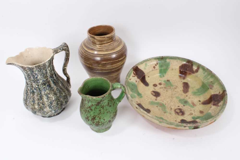 Four pieces of 19th century pottery, including an agate ware jar, two sponge ware jugs, and a large