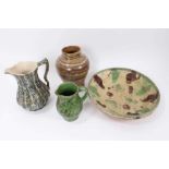 Four pieces of 19th century pottery, including an agate ware jar, two sponge ware jugs, and a large