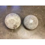 Two antique stone garden spheres, the largest approximately 35cm diameter