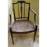 Good quality Edwardian neoclassical revival Hepplewhite style bergere chair with carved floral decor