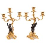 Pair of rococo revival ormolu cherub candelabra