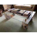Decorative glass coffee table, with rectangular top on dog of foo ceramic supports