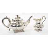Early Victorian silver tea pot of melon forn with engraved dedication and matching cream jug