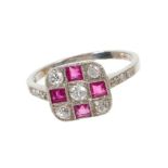 Art Deco platinum diamond and ruby ring of chequerboard design. Diamond set shoulders 'L' finger si