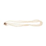 Cultured pearl two-strand necklace with gold, pearl and garnet clasp