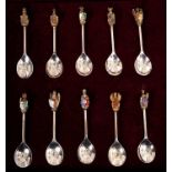 Cased set of 10 silver, silver gilt and enamel set of Queens Beast spoons.