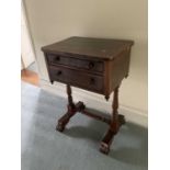 Regency rosewood work table, with rounded rectangular top and two fitted drawers on turned supports