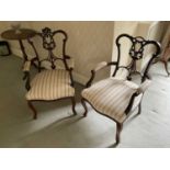 Pair of early 20th century mahogany open armchairs, with lattice backs on cabriole legs