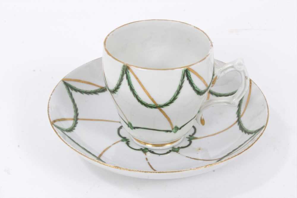 18th century Bristol ogee shaped coffee cup and saucer, decorated in green and gilt, circa 1775