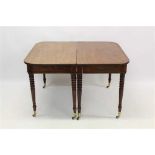 Good Regency figured mahogany extending dining table, with D-ends raised on ringed turned legs and b