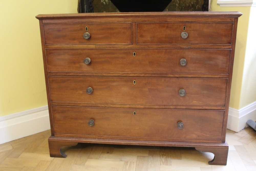 19th century mahogany chest of two short and three long graduated drawers with brass handles and coc