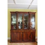 Good quality Regency flame mahogany two height breakfront bookcase with architectural pediment, the