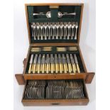 An extensive early 20th century canteen of silver cutlery, 111 pieces in total, in fitted oak case