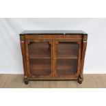 Early 19th century marble topped brass inlaid pier cabinet, enclosed by pair of glazed doors between