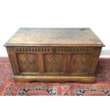 Antique carved and panelled oak coffer