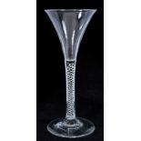 Georgian toasting glass of tall slender form with trumpet bowl, opaque twist stem on splayed foot 18