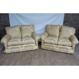 Pair of good quality two seater sofas upholstered in yellow fabric