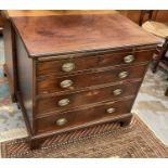 George III mahogany chest of drawers with brushing slide and four long graduated drawers with oval b