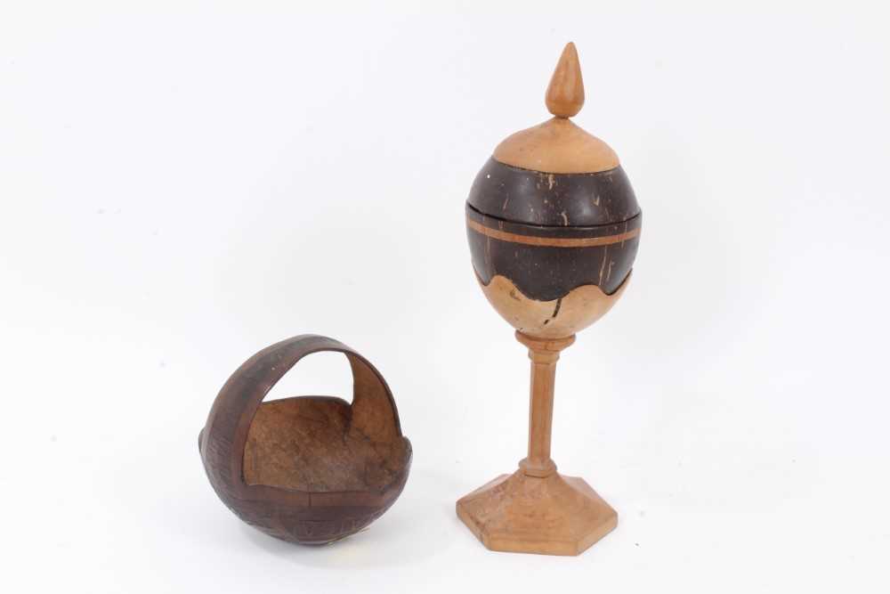 Carved coconut basket decorated with the Royal arms, together with a carved coconut cup on stand (2)