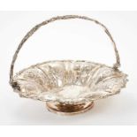 George III silver swing handled fruit basket of circular form, with embossed floral decoration