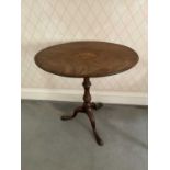 Regency oval topped mahogany occasional table, the tilt top with shell patera inlay on turned suppor